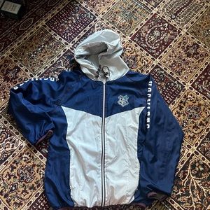 Blue and white Hogwarts windbreaker with a warm lining inside with the hood